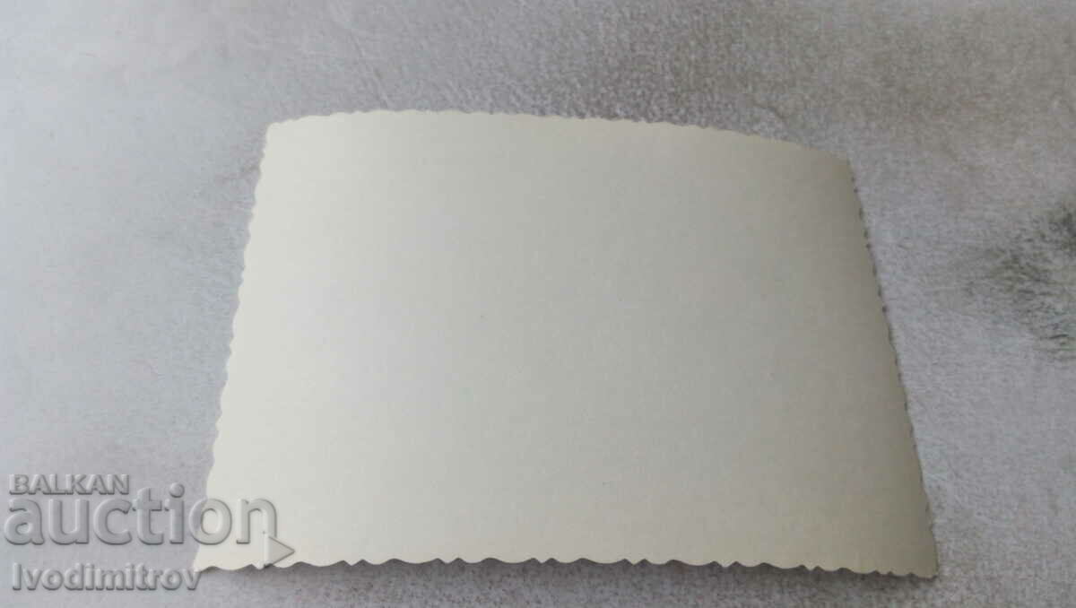 Photo Woman and three men on the railing of a hut in winter with price 0.75 BGN | € 0.38