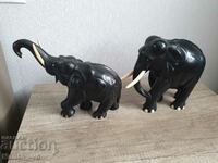 Two elephants of solid ebony wood and bone for tusks and claws