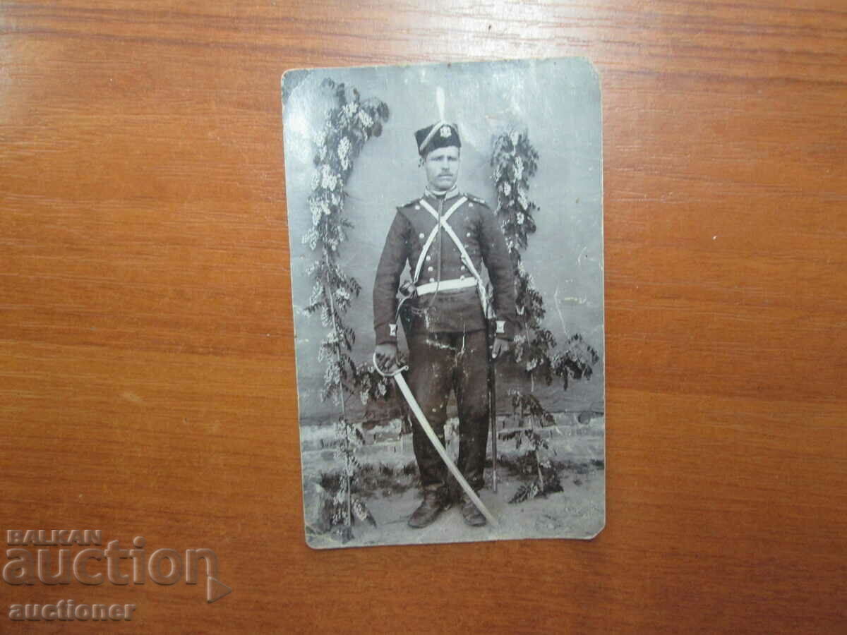 Auction  PRINCELY SOLDIER, UNIFORM, SWORD, CAP