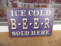 Μεταλλική επιγραφή μπύρας παγωμένη εδώ προς πώληση