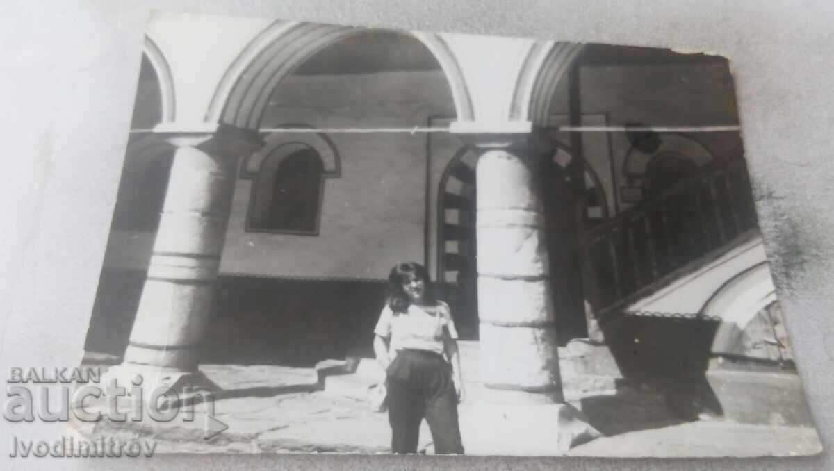 Photo Young woman in front of a monastery 1985