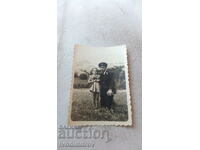 Photo Railwayman and a little girl on a meadow