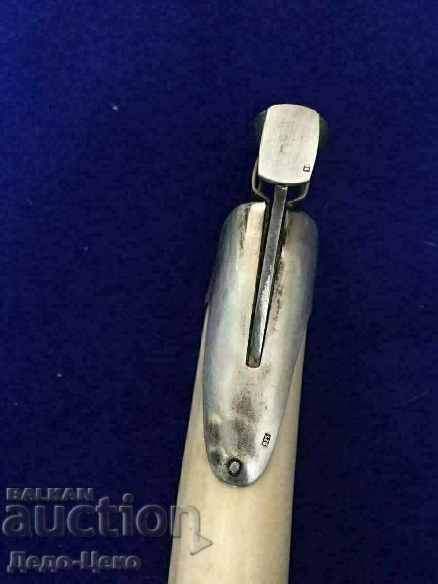 Auction Walrus tooth cigar cutter Auction Walrus tooth cigar cutter