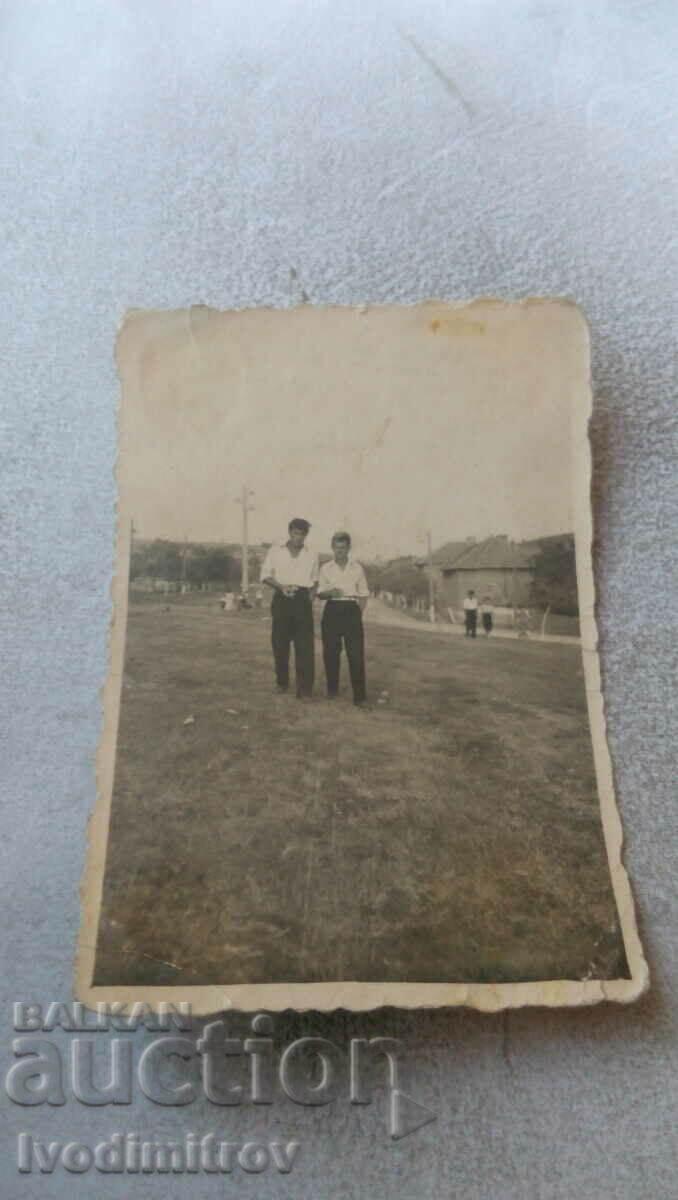 Photo Two young men near the village