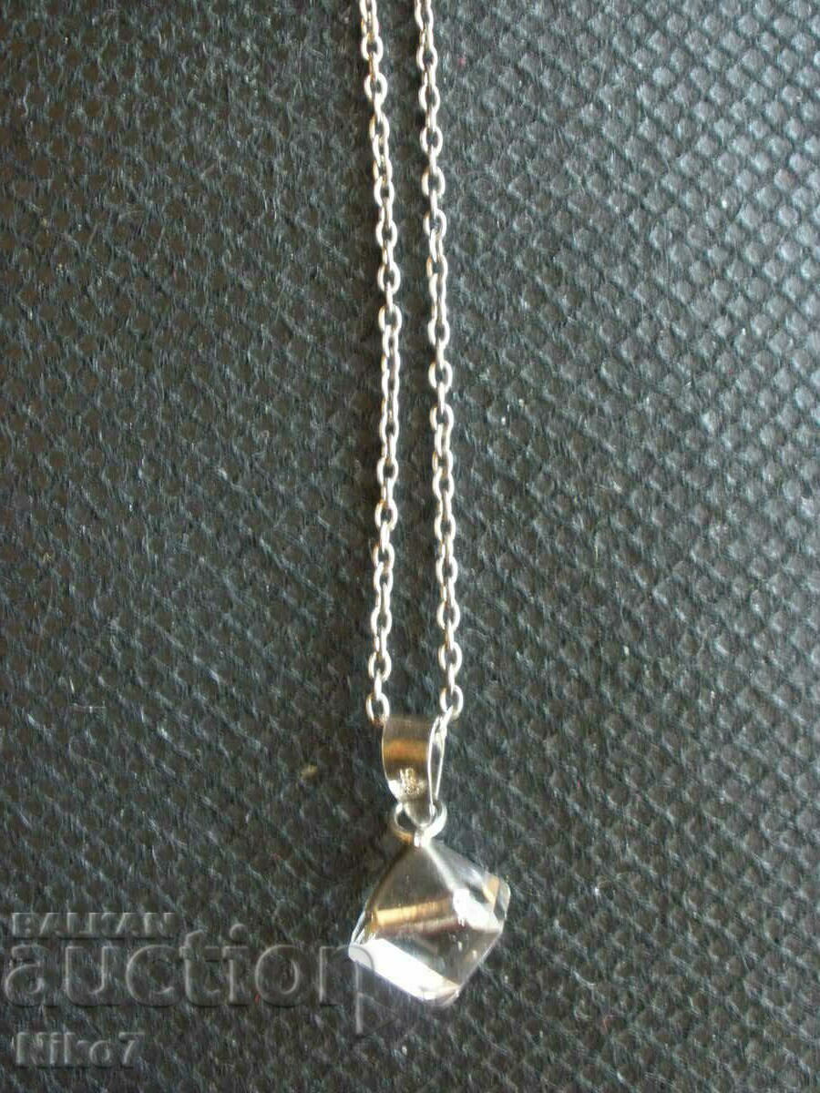 Interesting silver necklace with a stone.