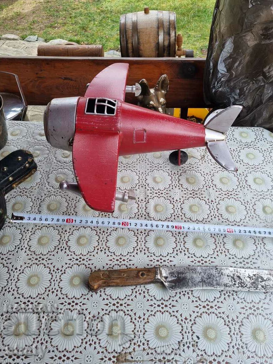 Metal model of an airplane. Clock