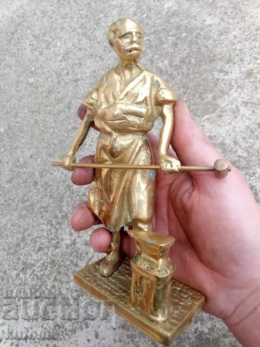 Delivery of Old solid bronze statuette of a blacksmith Delivery of Old solid bronze statuette of a blacksmith