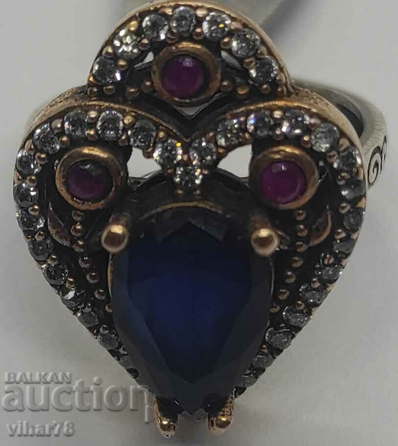 Silver ring with sapphire and rubies