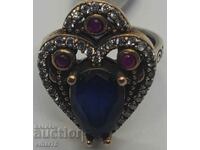Silver ring with sapphire and rubies