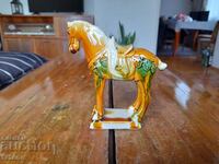 Old porcelain horse figurine