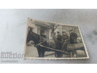Photo Three men with a cart