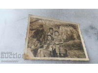 Photo Officer man children and woman with accordion in the garden