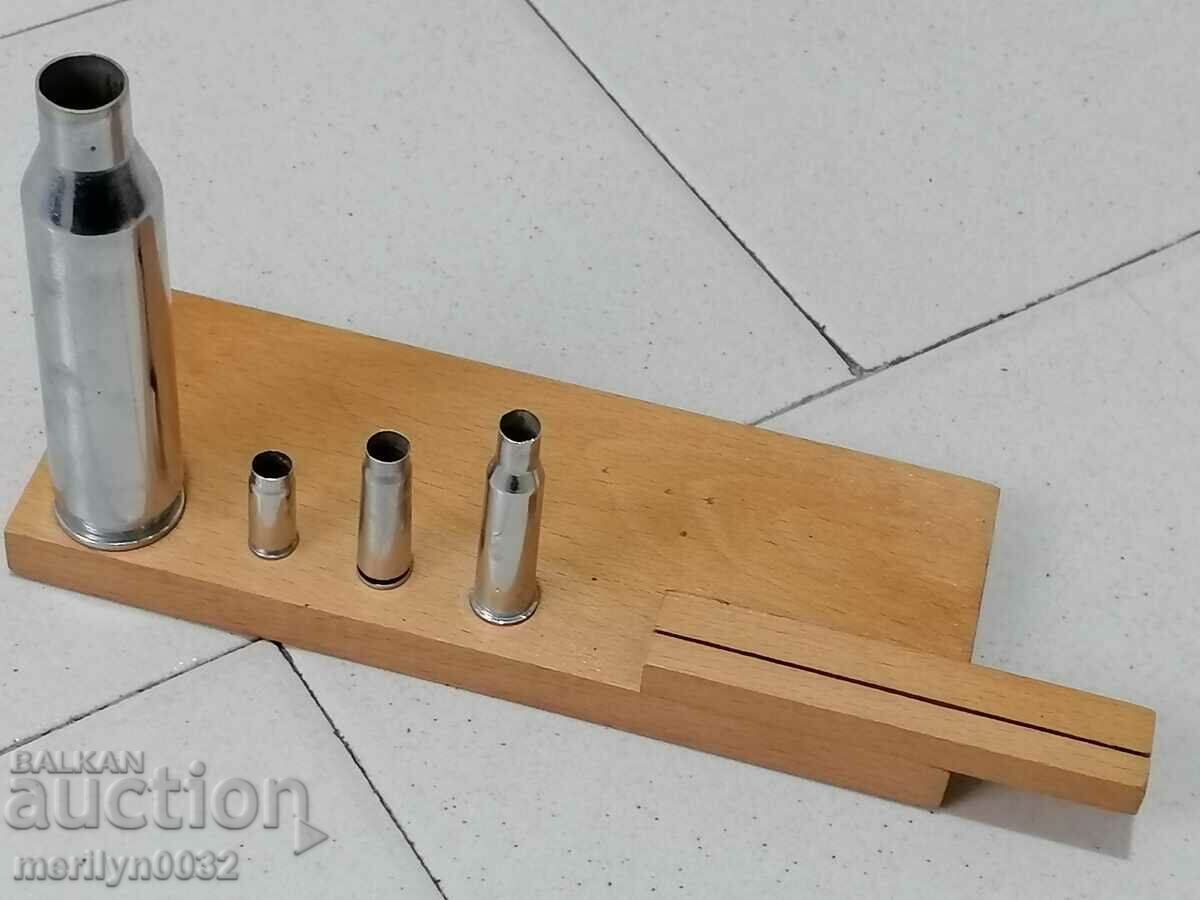 A set of cartridges, a sample cartridge case, a demonstration model