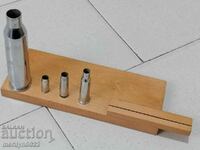 A set of cartridges, a sample cartridge case, a demonstration model