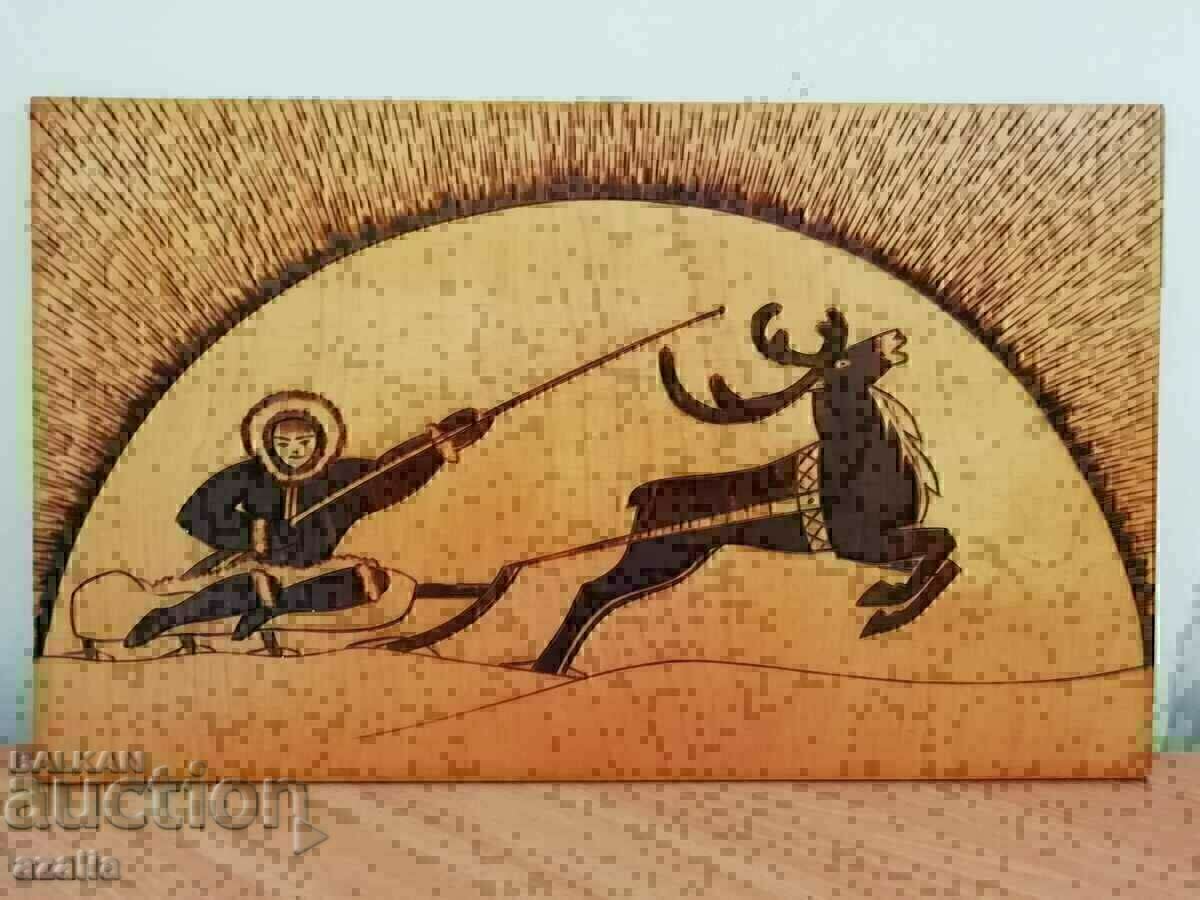 A painting from the Kola Peninsula - pyrography. Deer team.