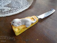CHEESE KNIFE WITH AN INTERESTING CERAMIC HANDLE