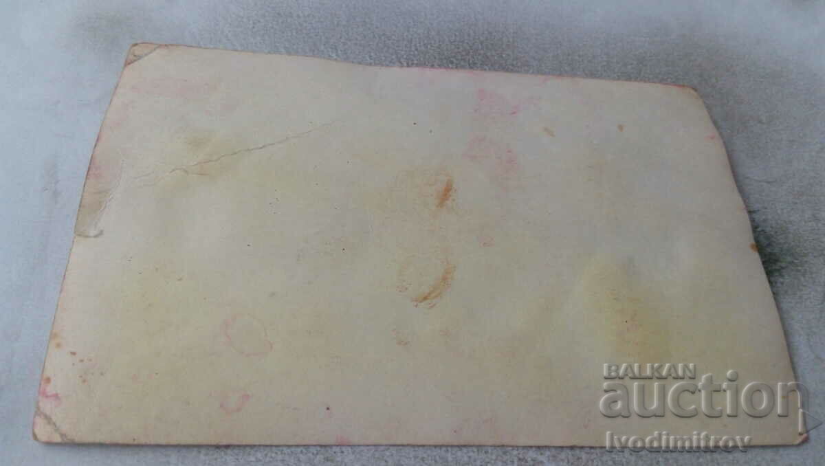 Photo Man in front of a pile of wood with price 0.85 BGN | € 0.43 Photo Man in front of a pile of wood with price 0.85 BGN | € 0.43