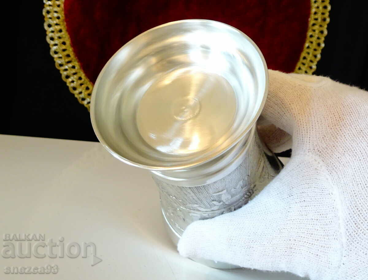 A mug, a pewter goblet with a painting Table. - 7 A mug, a pewter goblet with a painting Table. - 7