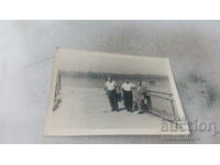 Photo Three men on the pier