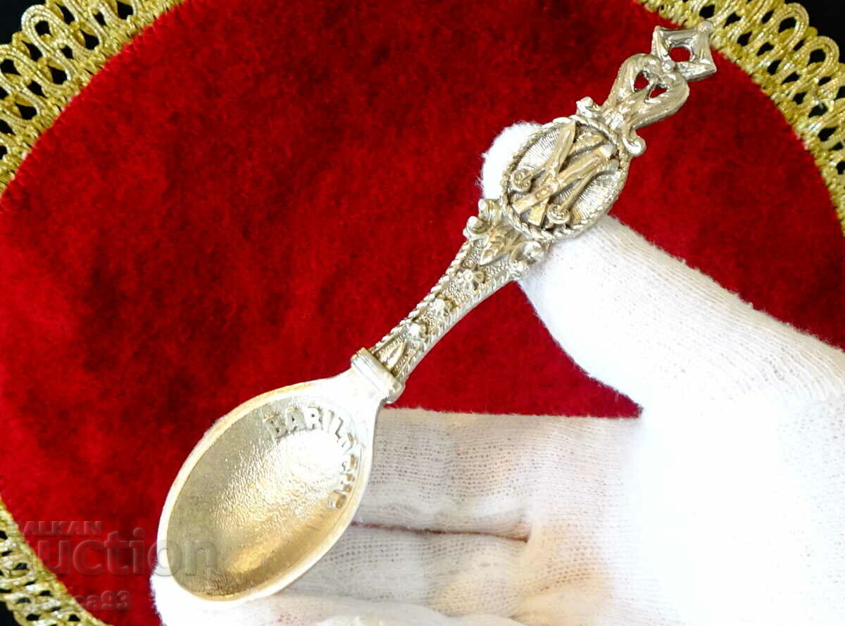 Pewter spoon for skiers.