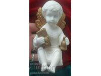 An alabaster angel figure