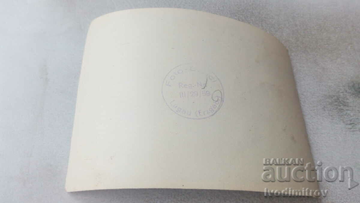 Photo A man in a winter coat next to an Olympia car with price 0.75 BGN | € 0.38 Photo A man in a winter coat next to an Olympia car with price 0.75 BGN | € 0.38