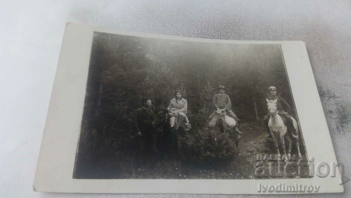 Mrs. Officer, two men and a woman with horses on their way back from Dobralak