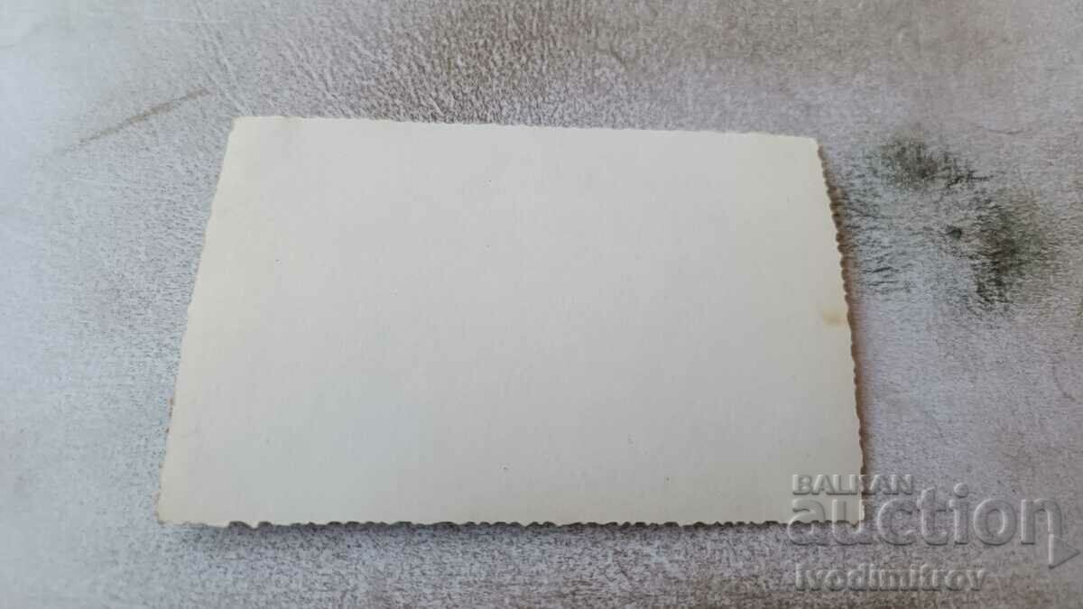 Photo Elderly woman man and young woman in front of a country house with price 0.85 BGN | € 0.43