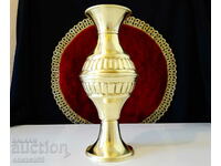 Relief vase, carafe made of brass.