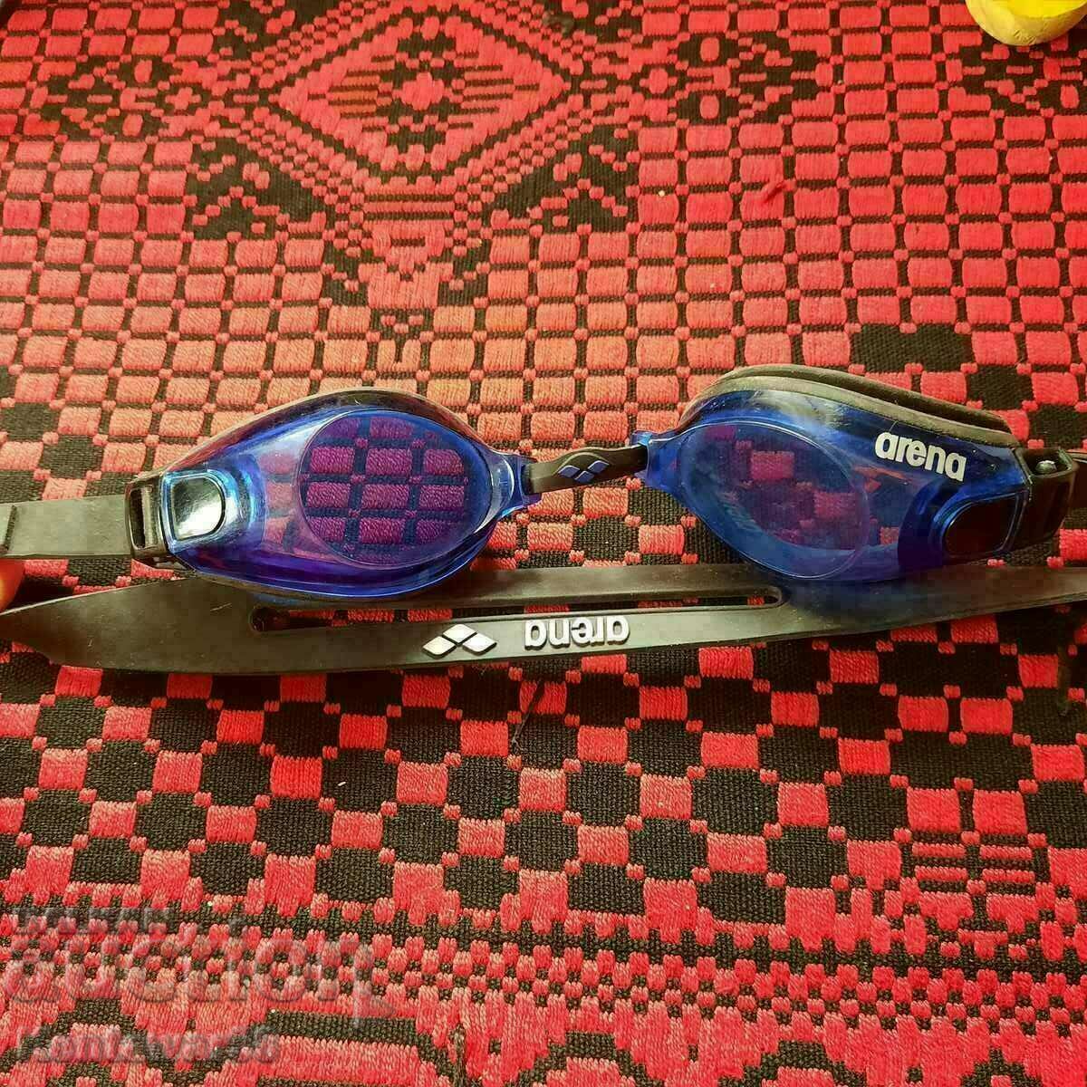 Arena swimming goggles.