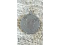 Old coin with hanging ring