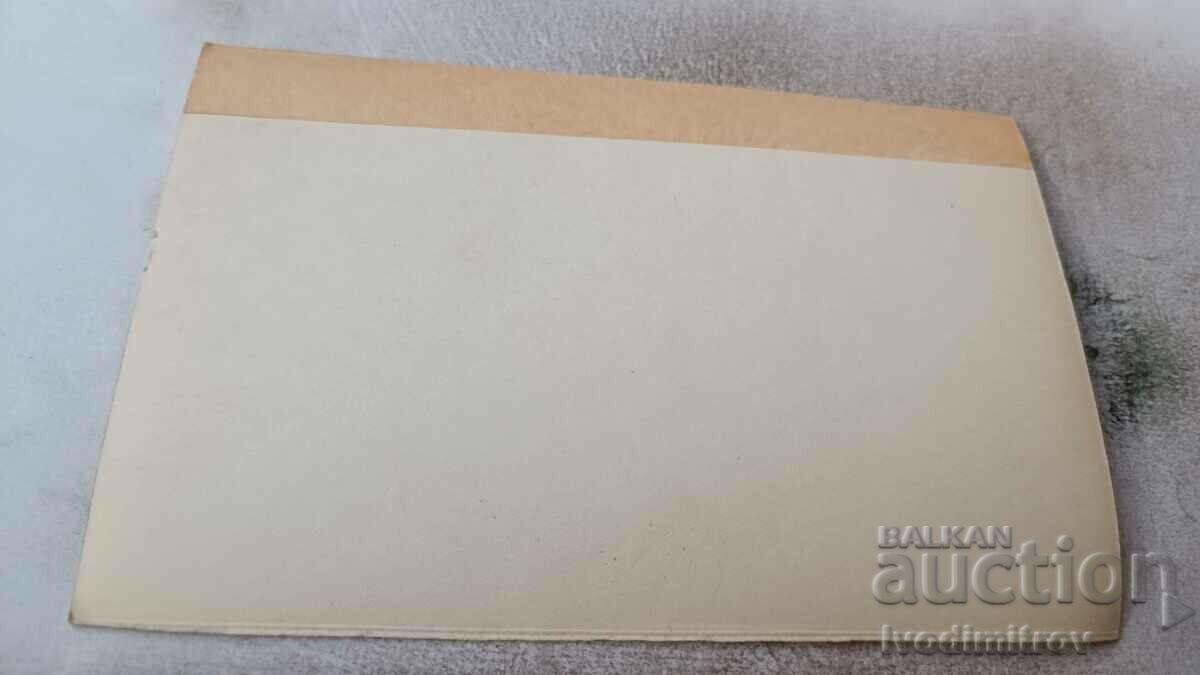 Photo Men and women on the street in front of an Esperanto bookstore with price 2.45 BGN | € 1.25 Photo Men and women on the street in front of an Esperanto bookstore with price 2.45 BGN | € 1.25