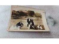 Photo Three young men and two girls in the skirts of Sredna Gora