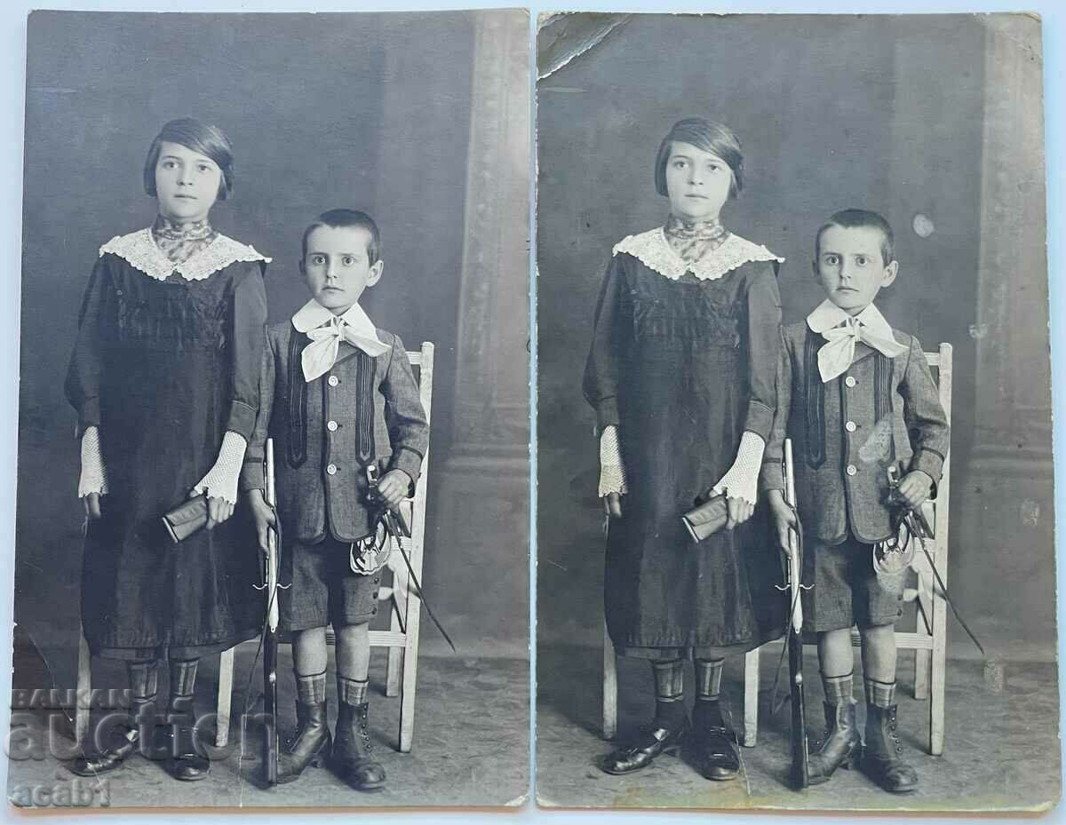 Children in a photo with a rifle and a saber with price 11.99 BGN | € 6.13 Children in a photo with a rifle and a saber with price 11.99 BGN | € 6.13