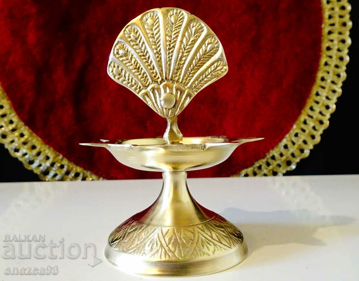 Delivery of Bronze candlestick with Peacock.