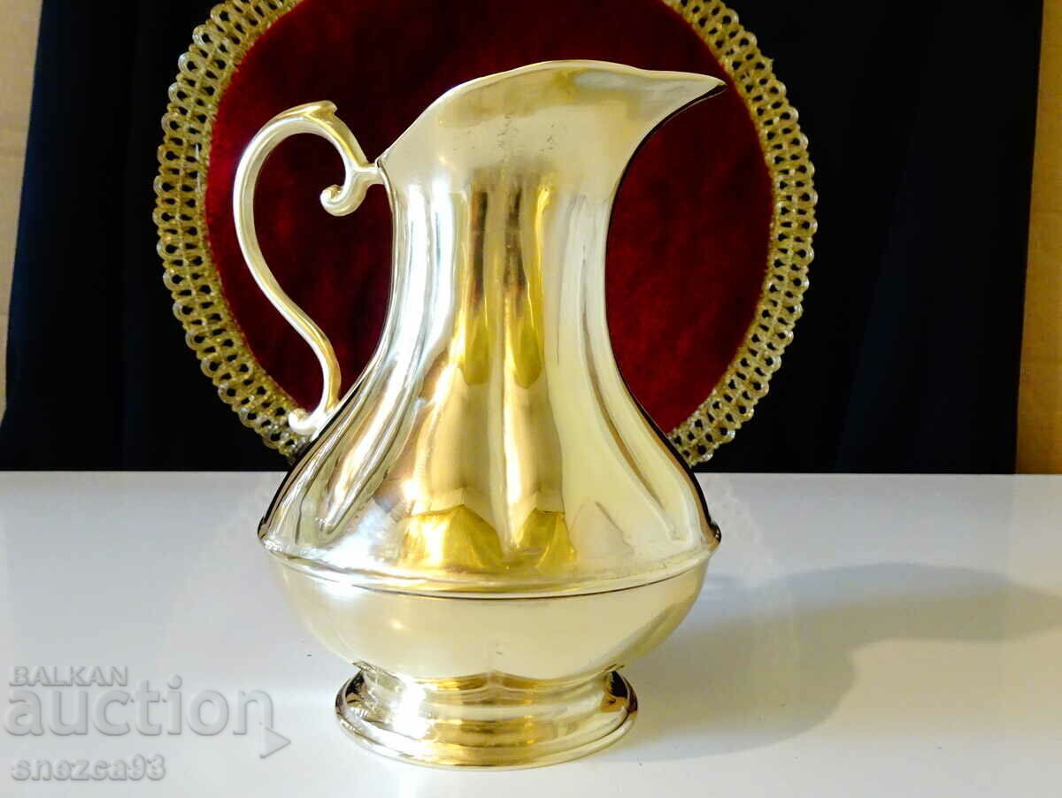 Auction  Massive bronze jug for wine, relief.