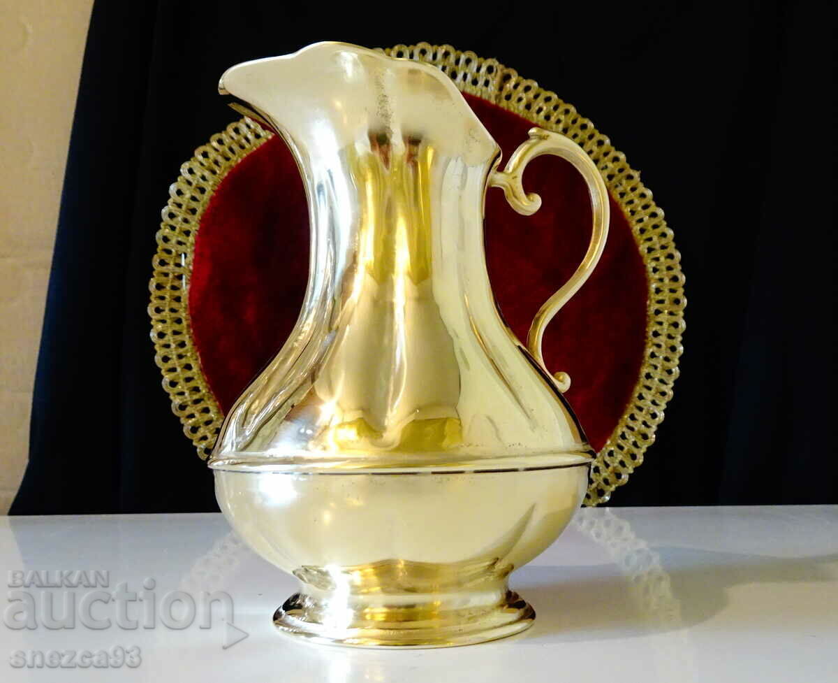 Massive bronze jug for wine, relief.