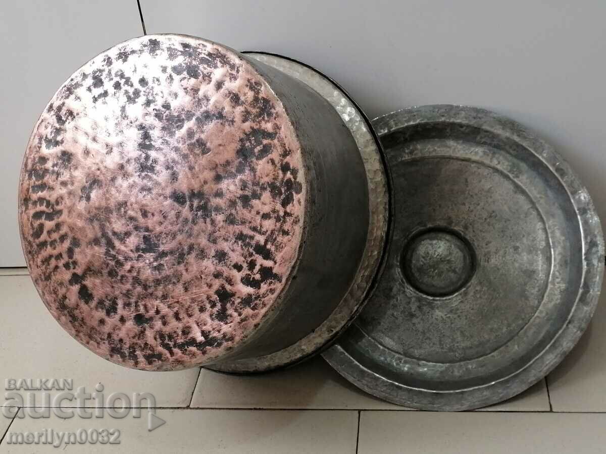 Delivery of An old bakery saucepan, a baker, a brass copper pot Delivery of An old bakery saucepan, a baker, a brass copper pot