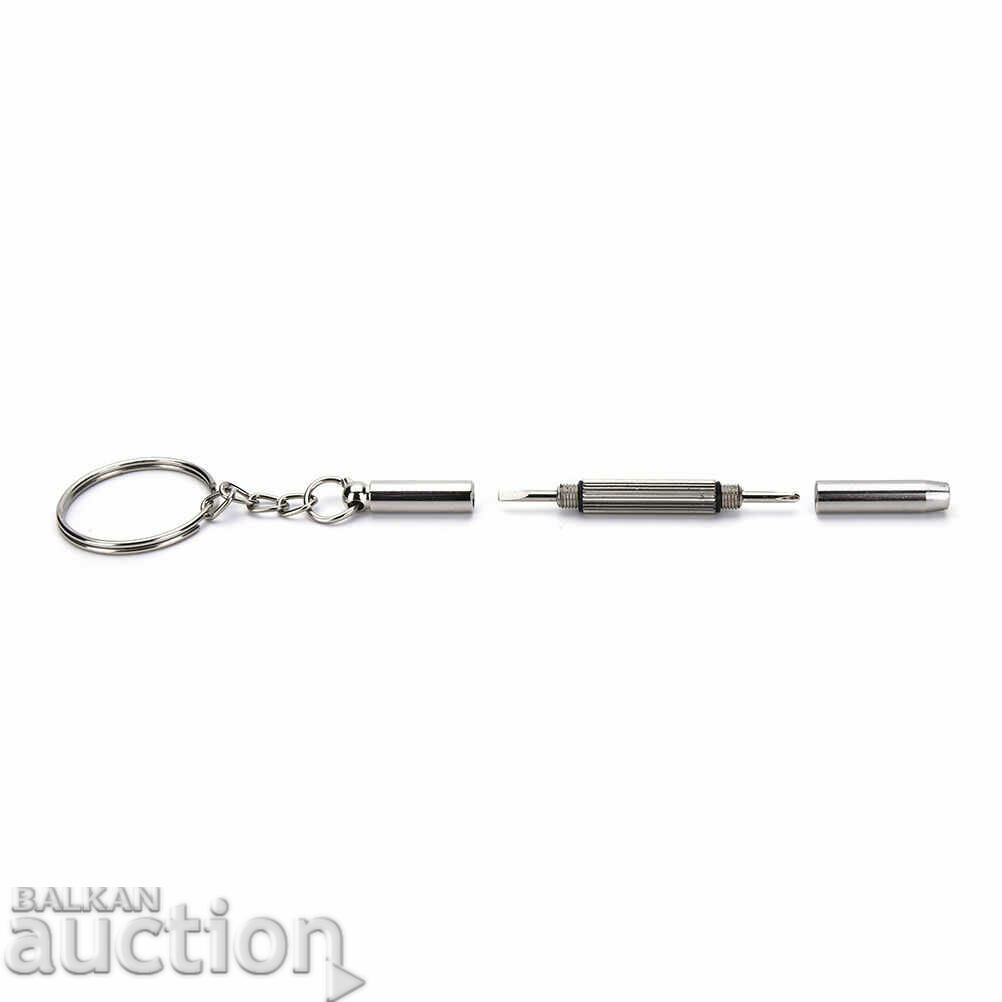 O șurubelniță mică pe un inel de chei îndreptă crucea și hexagonal - 7 O șurubelniță mică pe un inel de chei îndreptă crucea și hexagonal - 7