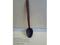 Old wooden spoon, ladle.