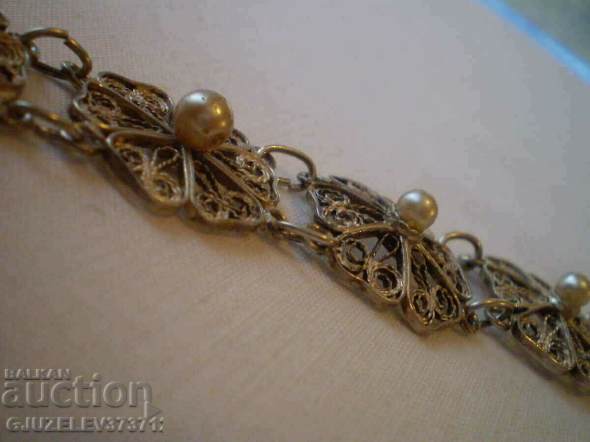 Auction women's filigree bracelet with pearls Auction women's filigree bracelet with pearls