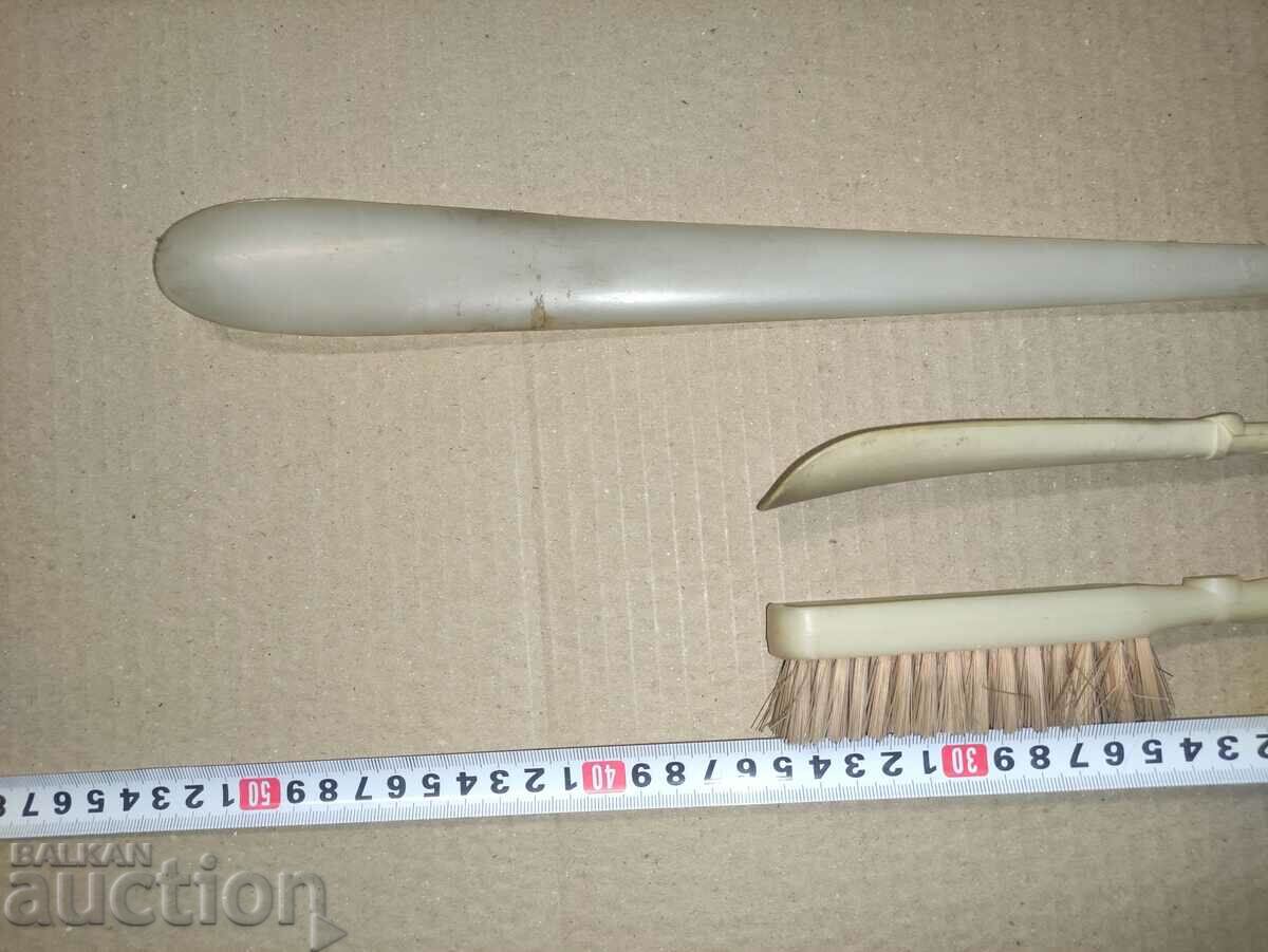 Auction  Shoes and a brush with figures of a horse, a head