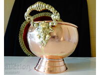 Copper vessel with bronze handles, lion heads.