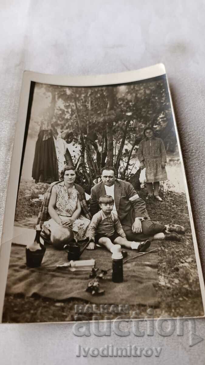 Photo Sofia Kazichene A man, a woman and a little boy on a picnic, 1930