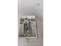 Photo Varna A woman and a little girl on a vintage bicycle