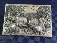 Beautiful relief sculpture of a family of elephants