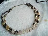 old beautiful necklace made of natural glass