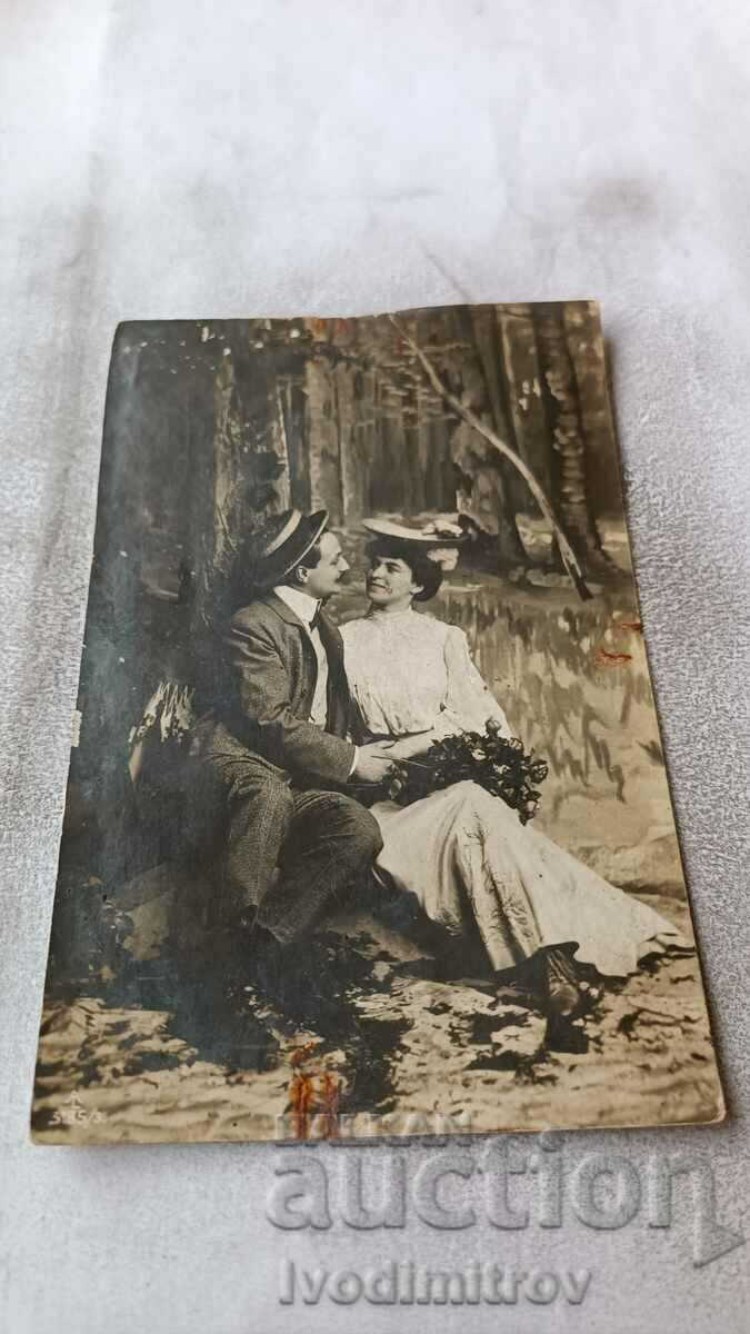 Postcard Man and woman in the forest