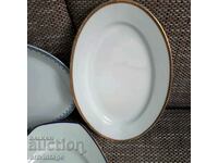 Two oval plates with gold edging