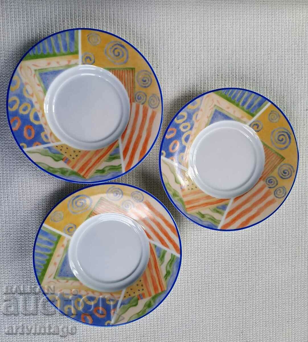 Three colored saucers